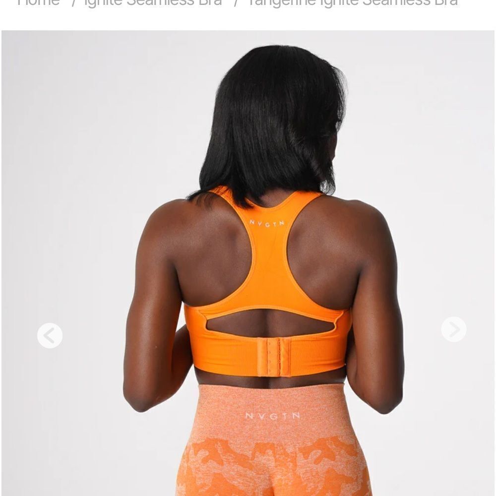 NVGTN orange Ignite sports bra size M. NWT